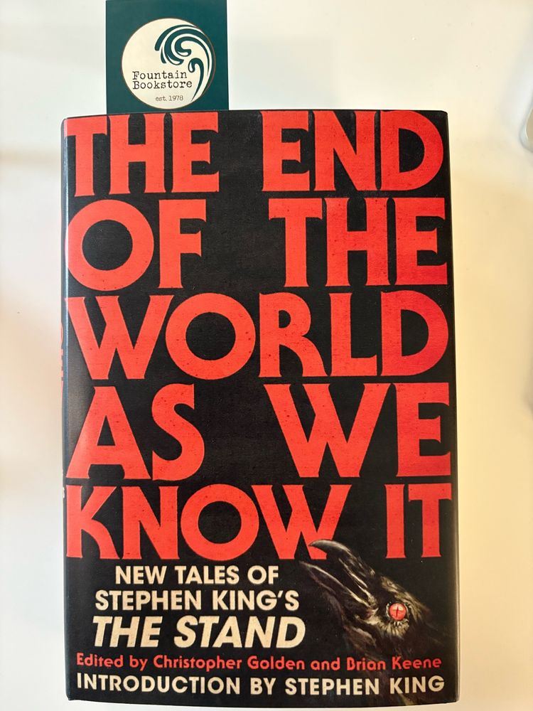 The cover of the short story collection THE END OF THE WORLD AS WE KNOW IT. Peeking out is a book mark with the Fountain Bookstore printed on it.