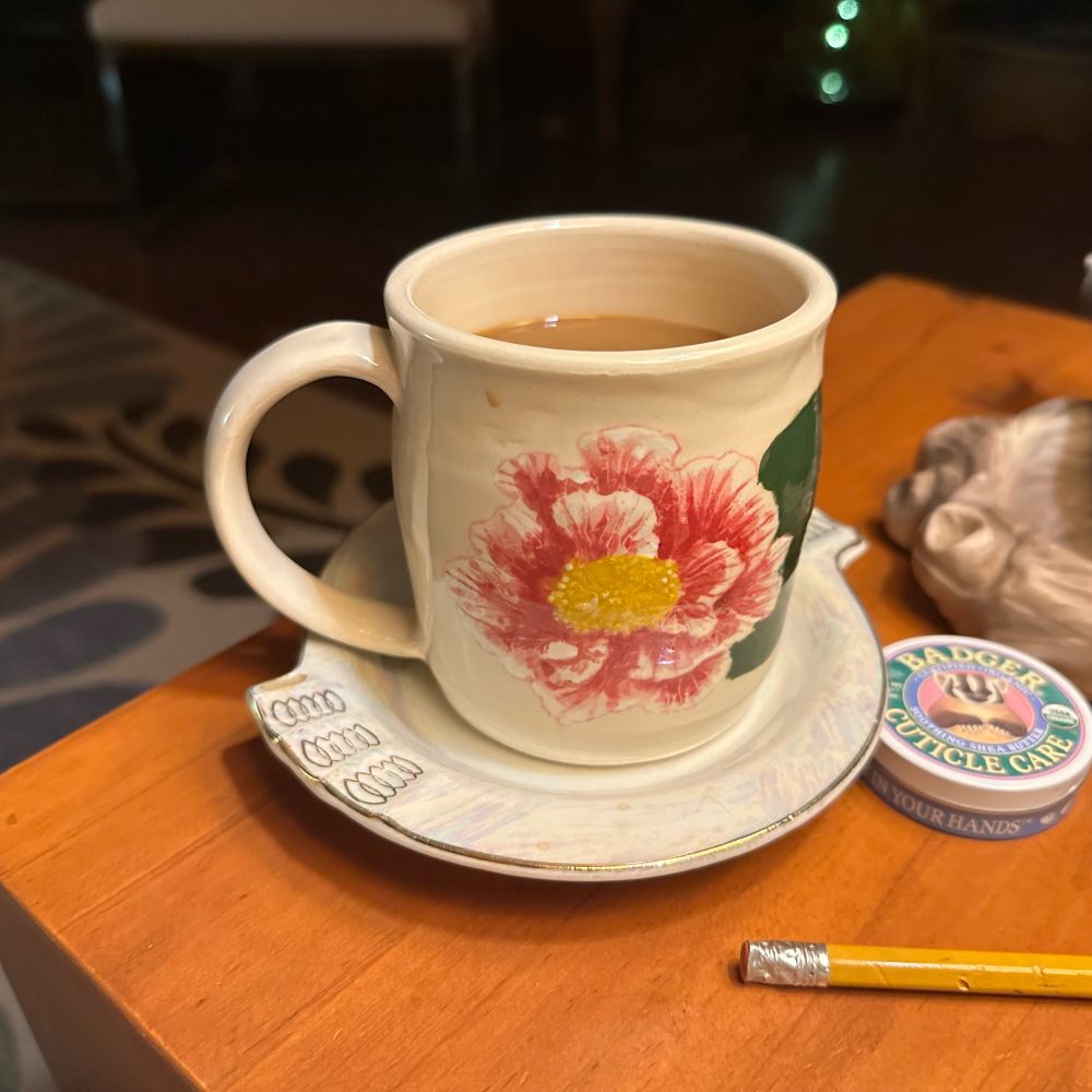 coffee in finished glazed mug with camellia design