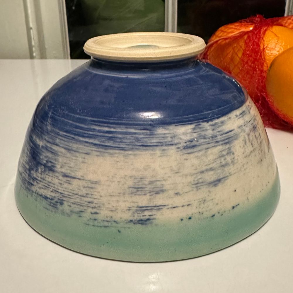 Upside-down bowl decorated with blue slip and light green glaze