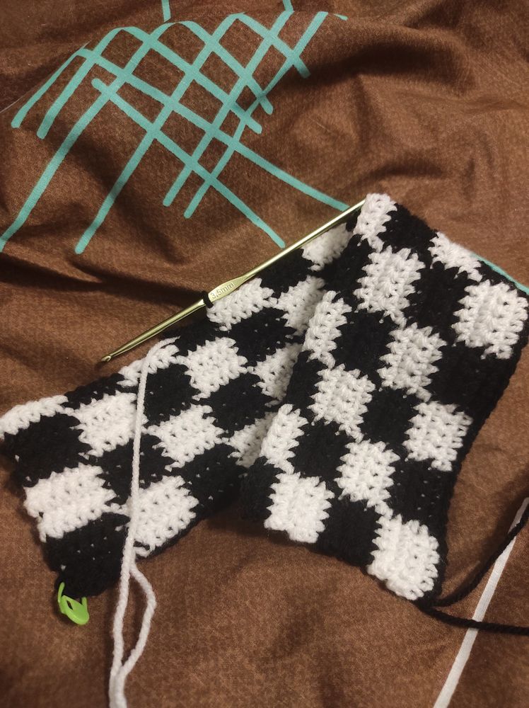 black and white piece of crocheted fabric