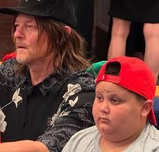 Norman Reedus and the child known as The Rizzler for reasons unknown to me