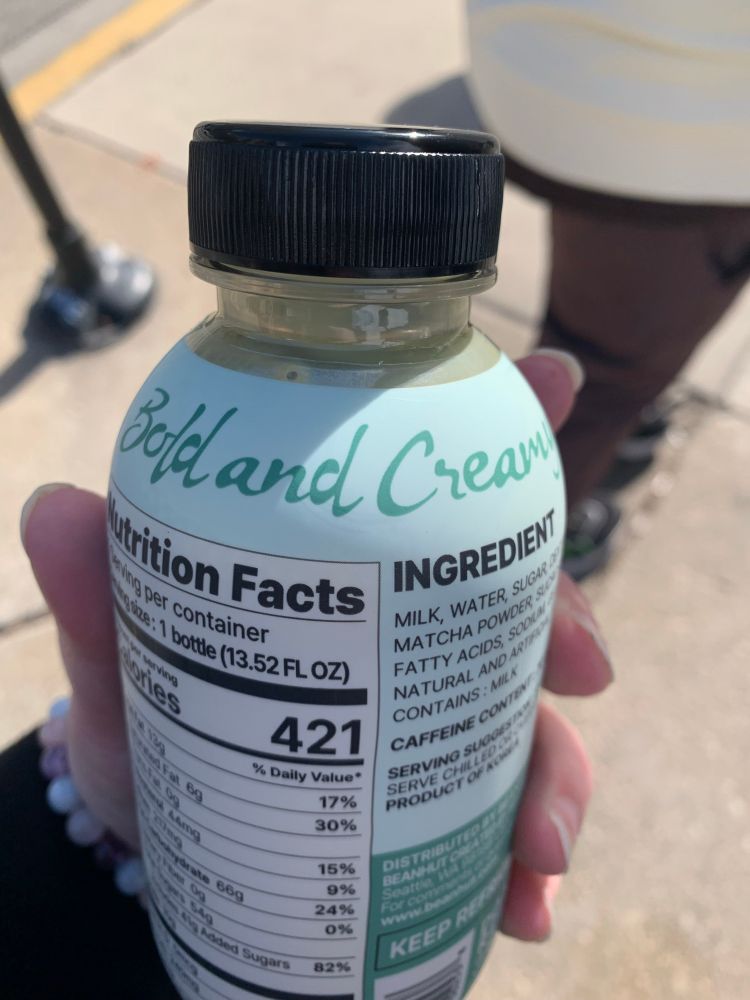 The back view of the same matcha bottle that says Bold and Creamy