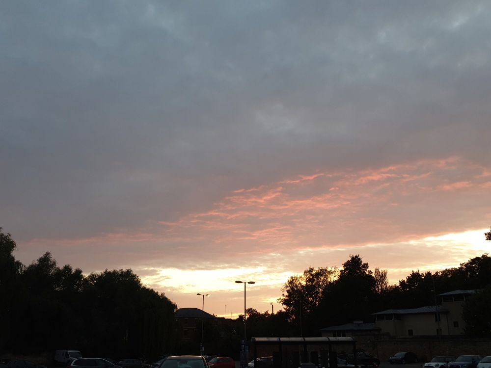 photo of a sunset sky with beautiful pink-orange clouds