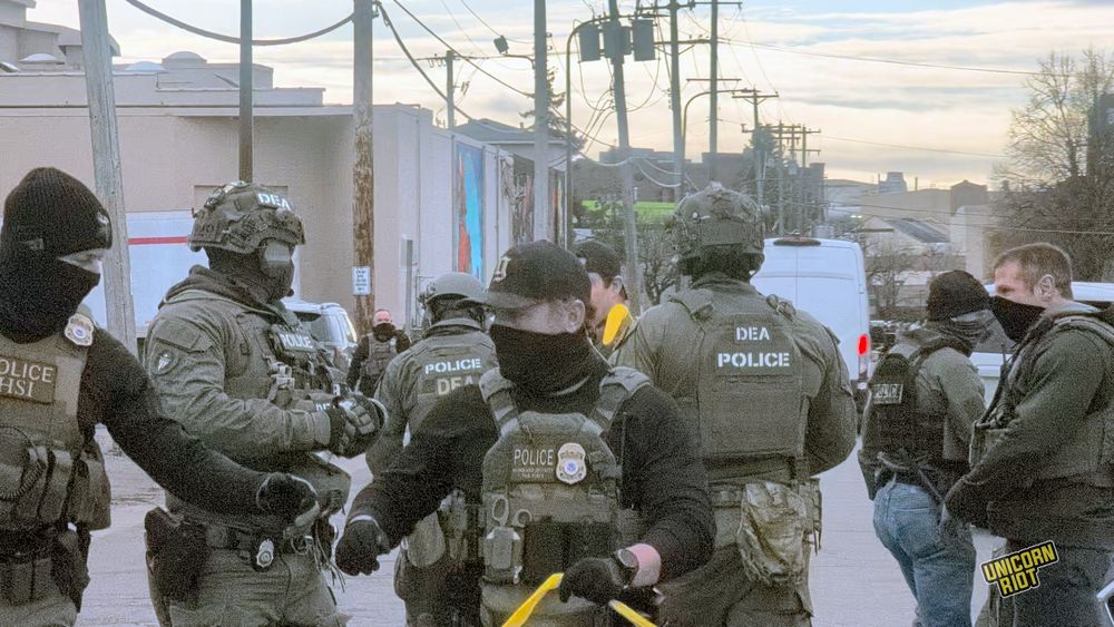 masked agents - wide shot