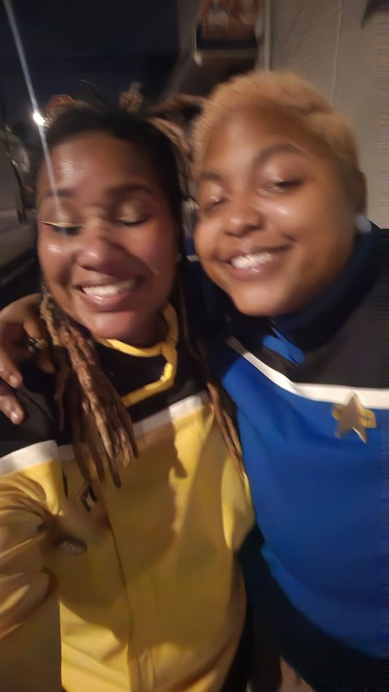 Smiling at the camera blurry.
