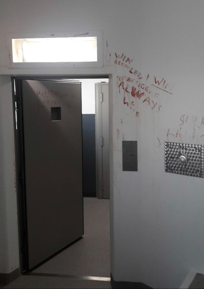 A Finnish jailcell, covered in hundreds of words written in blood. 