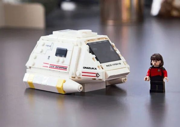 The shuttlecraft Onizuka, attached to the USS Enterprise-D, featuring Ro Laren as pilot.  This image is rendered in Lego bricks.
