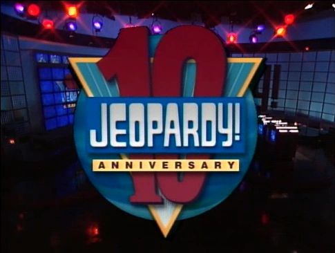 Jeopardy! 10th anniversary logo from 1994. The main portion of the logo shows capital letters, with the exclamation point in a somewhat raised position. Its top is consistent with the tops of the letters, but there is space for a second dot beneath the dot that's present. Below the title is the word 
