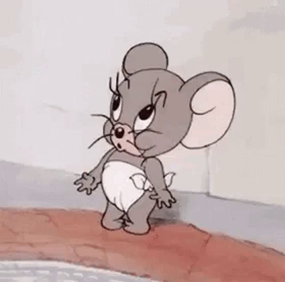 a cartoon mouse wearing a diaper is standing on a bridge .