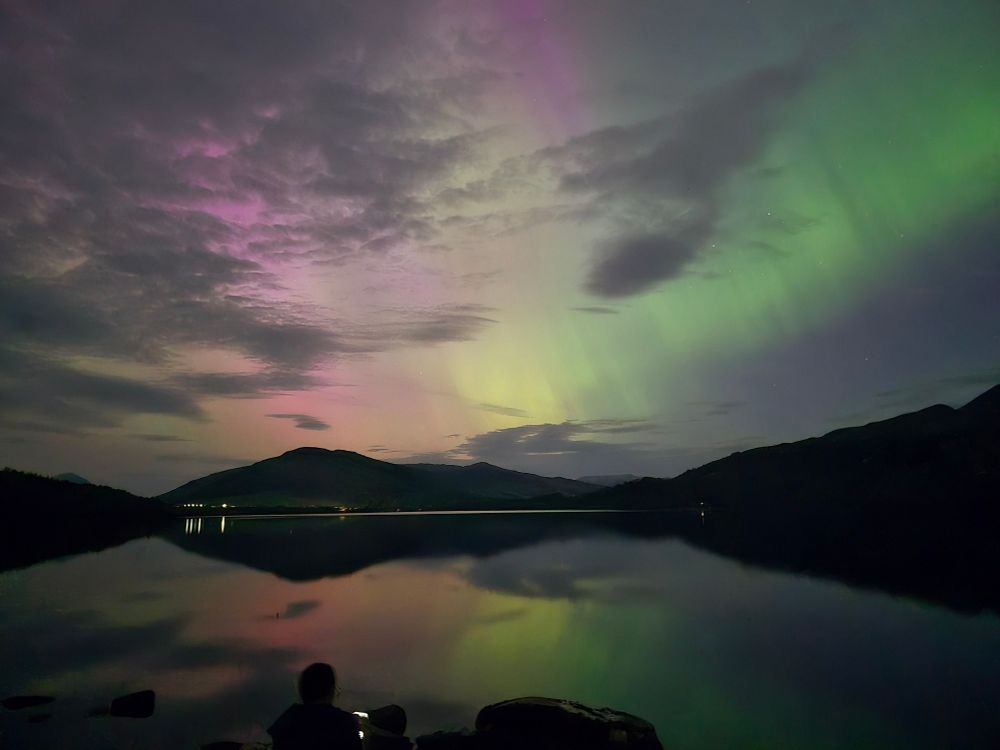 Pink and green aurora over Loch Tay