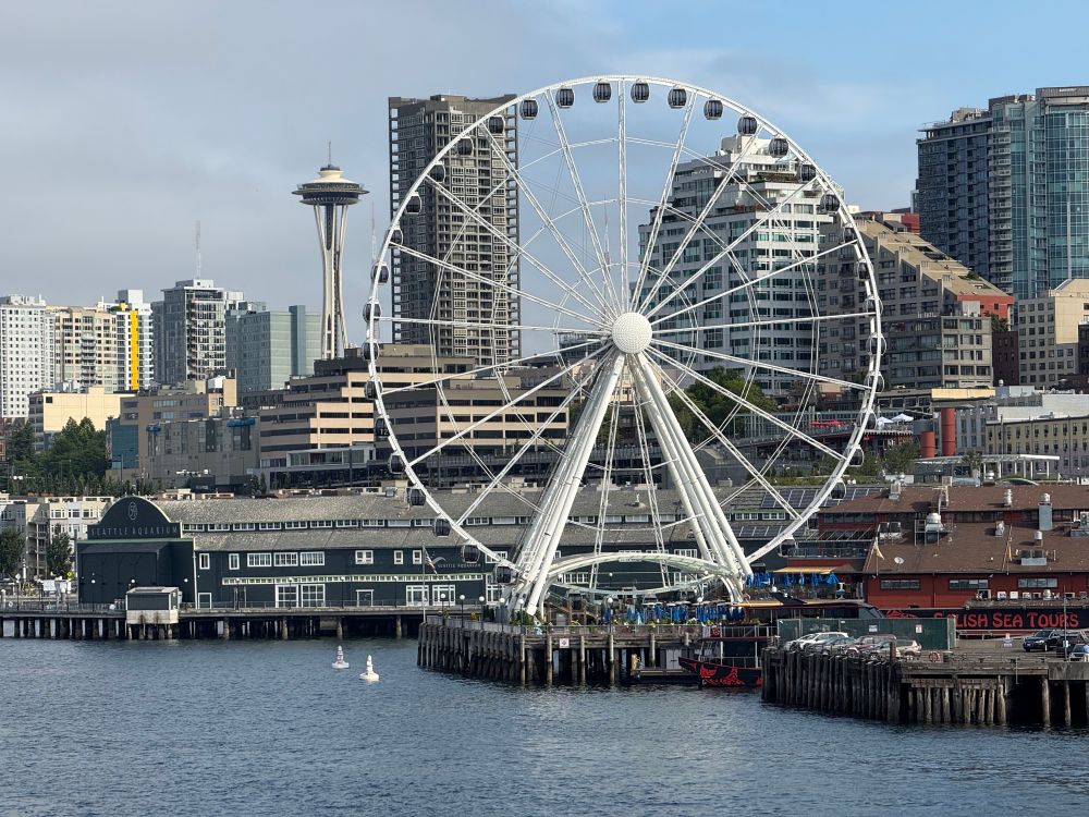 Seattle space needle and great wheel viewed from ferry