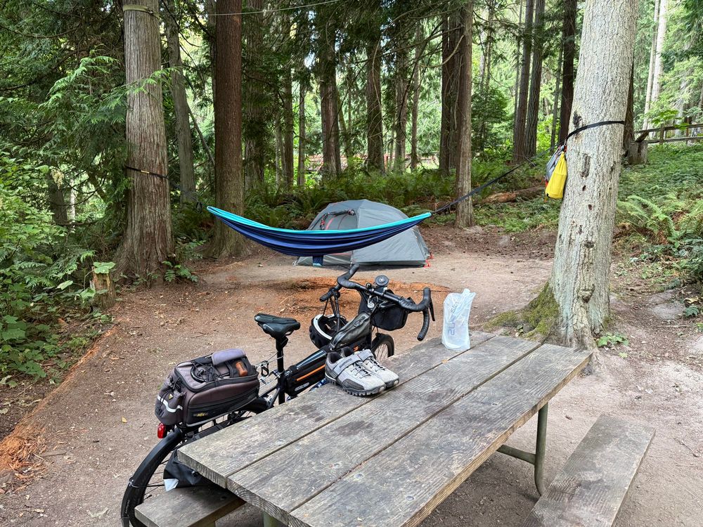 Campground with bike and tent and hammock