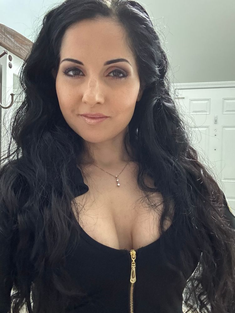 Upper half of Busty brunette Hannah Perez’s body in sexy cop top