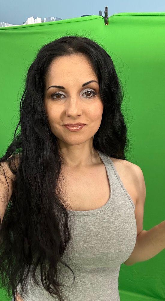 Hannah Perez brunette fetish model posing casually in front of green screen