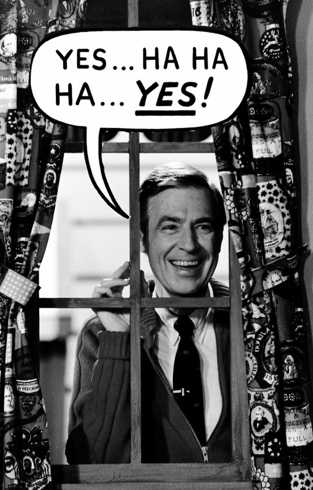 black and white photo of mr rogers smiling behind a window under a speech bubble saying "YES... HA HA HA... YES!"
