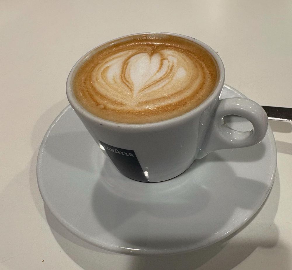 Caffe macchiato with heart in the foam. 