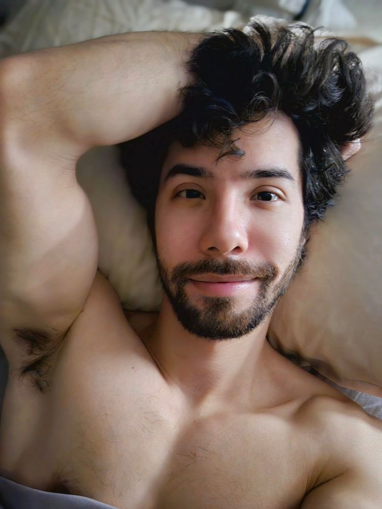 Selfie of me laying in bed with a lil smirk