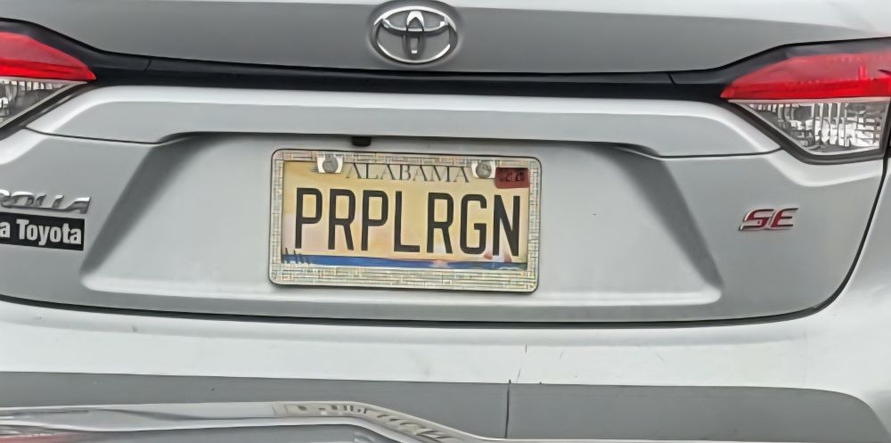 An Alabama automobile license plate reading PRPLRGN (purple reign)