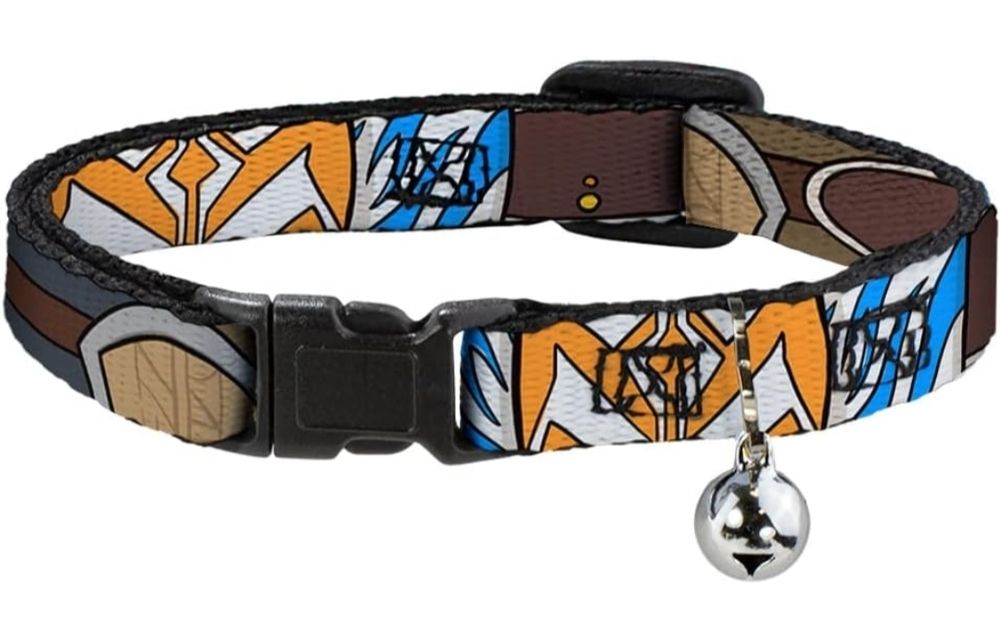 A small cat collar with a bell, black plastic buckles, and representations of the facial and lekkular markings of Ahsoka Tano, a Togruta Jedi. Background is just white.