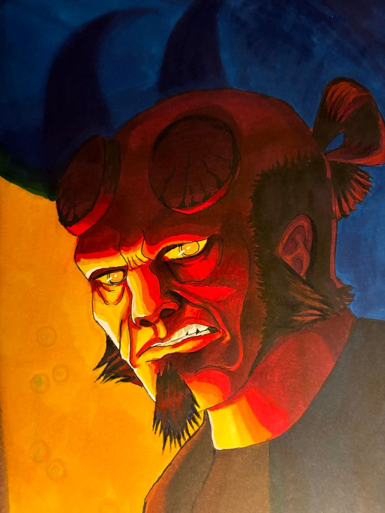 A alcohol marker portrait of Hellboy from the comics of the same name. His skin is red, he has glowing gold eyes, and his black hair is done up in a pseudo-samurai bun. He also has horns which have been sanded down. He's lit from the bottom left corner and the background is gold until it reaches his left horn where the light gets cut off and the background transitions to a dark blue. His shadow on the wall reveals his missing horns.