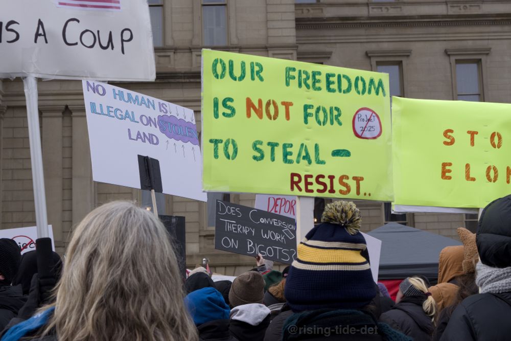 Protest signs: 

1) No human is illegal on stolen land

2) Our freedom is not to steal - RESIST

3) Does conversion therapy work on bigots?

4) Stop Elon