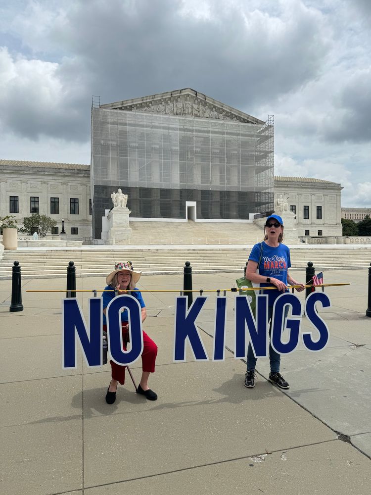 Activists hold sign NO KINGS at SCOTUS 