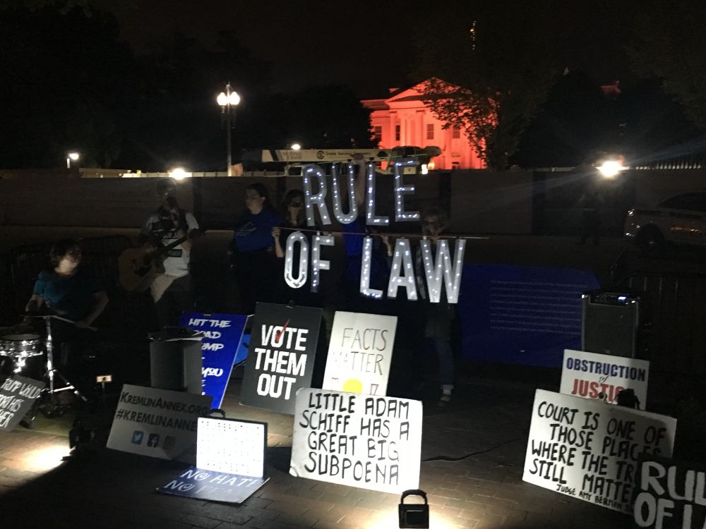 Activists hold sign RULE OF LAW at Trump 1.0 White House 