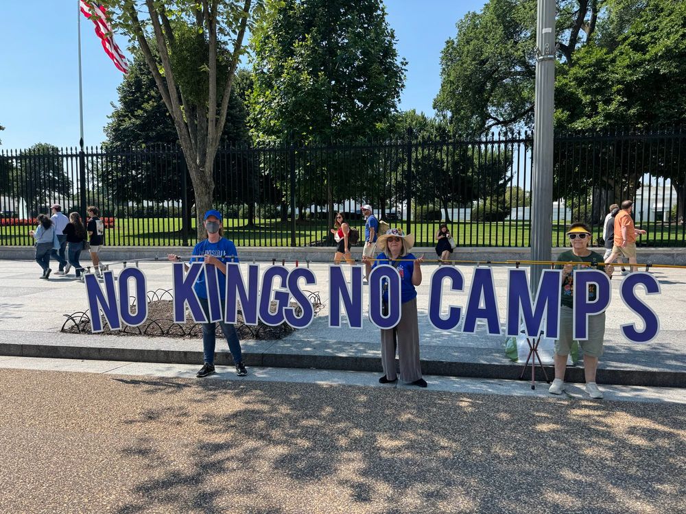 Elderly hippies hold NO KINGS NO CAMPS at White House