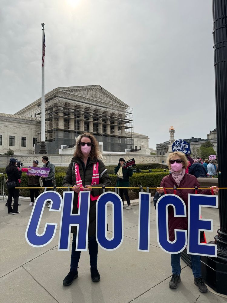 Activists hold sign CHOICE at SCOTUS 