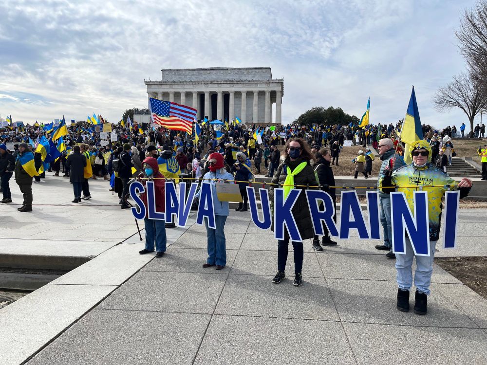 Activists hold sign SLAVA UKRAINI Lincoln Memorial DC