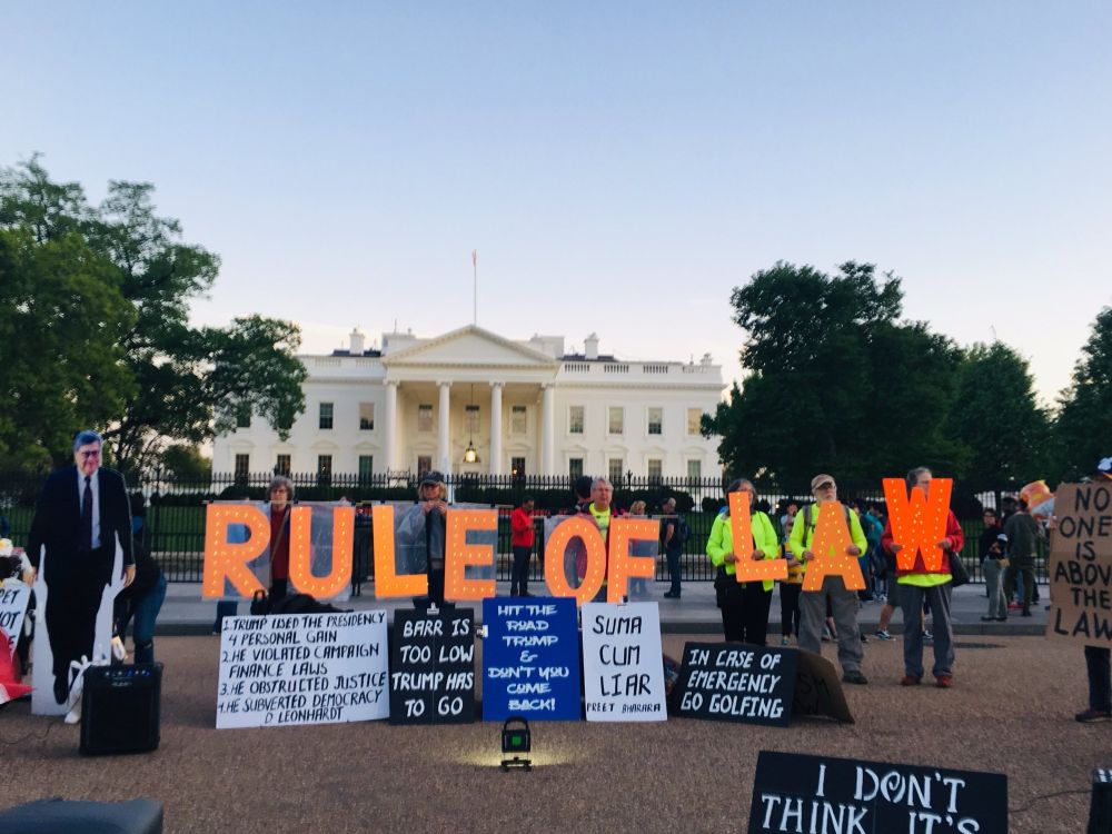 Activists hold sign RULE OF LAW at Trump 1.0 White House 