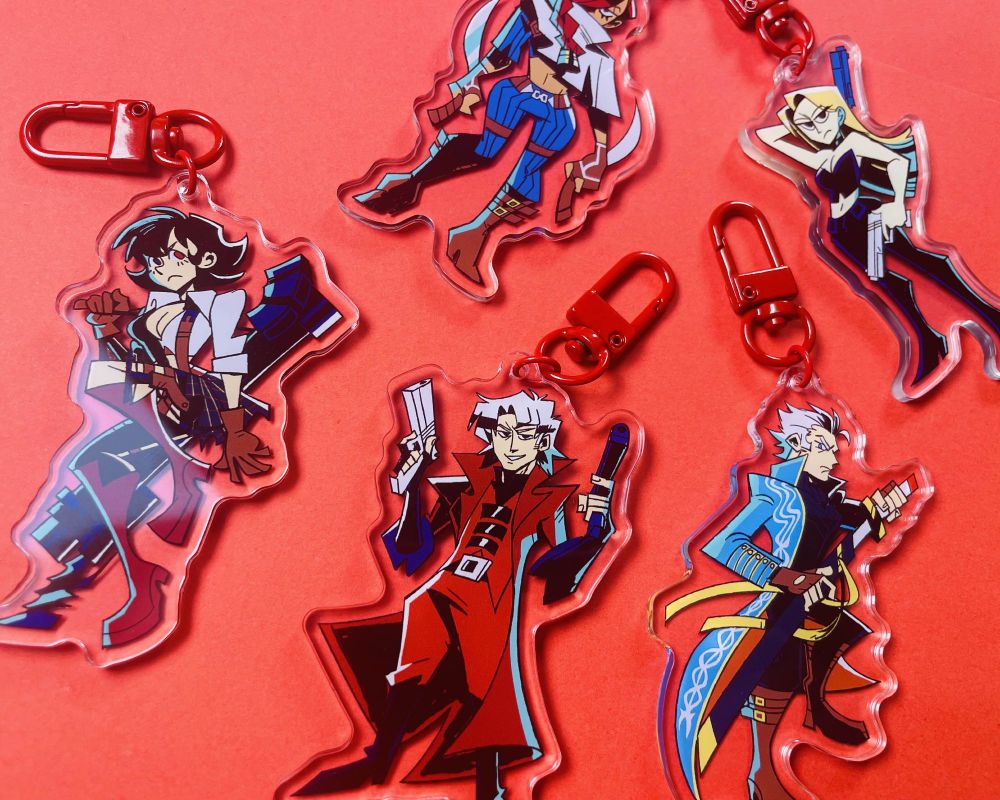 Photo of a collection of DMC character charms on a red background.