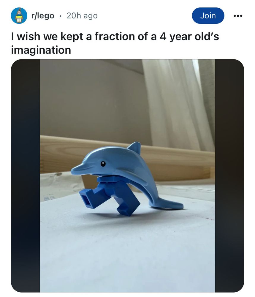 Screen capture of a post from r/lego titled "I wish we kept a fraction of a 4 year old's imagination. The post is of a photograph of a minifig's legs plugged into the bottom of a lego dolphin, strutting around the room.