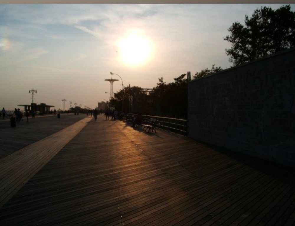 Coney Island boardwalk in low light. 