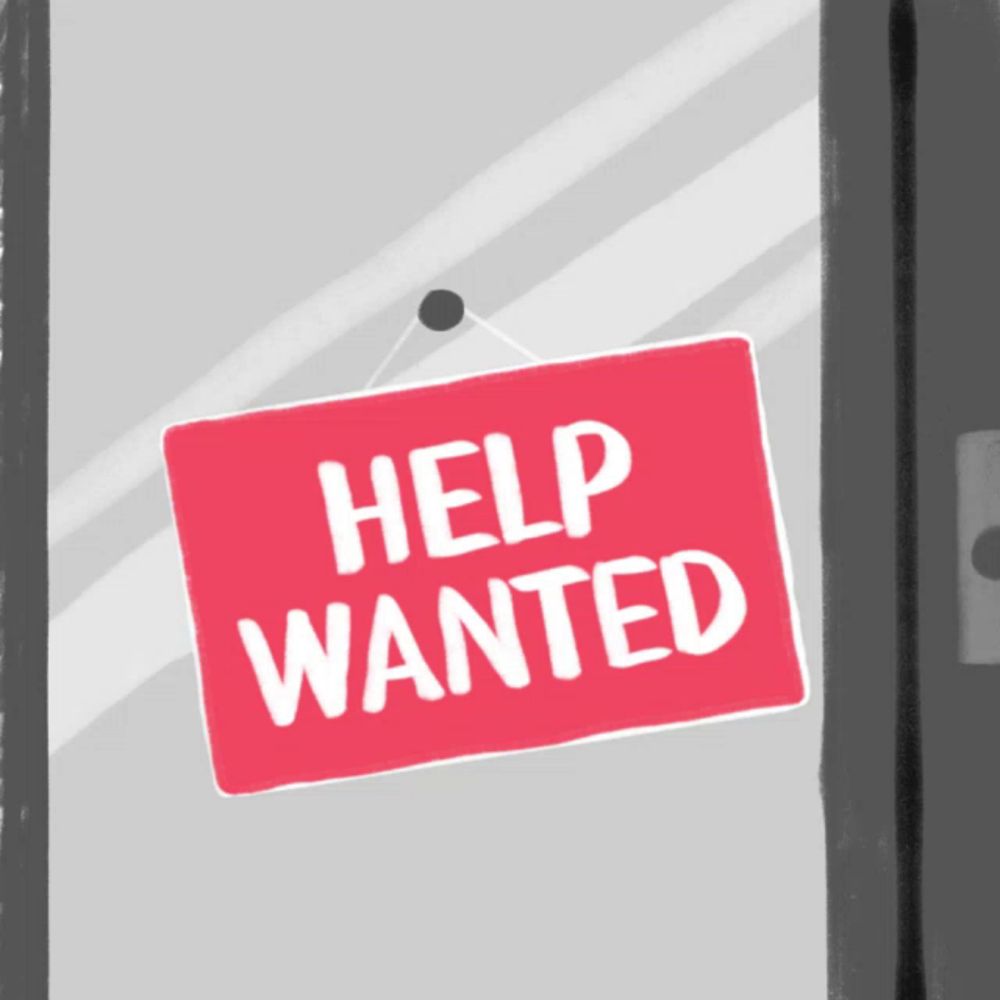 a red sign that says " help wanted " hangs on a door