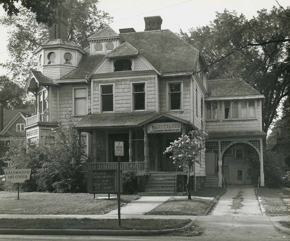 Black & white photograph of a Victorian mansion, circa 1958, with signage indicating the home of the Kalamazoo Art Center.