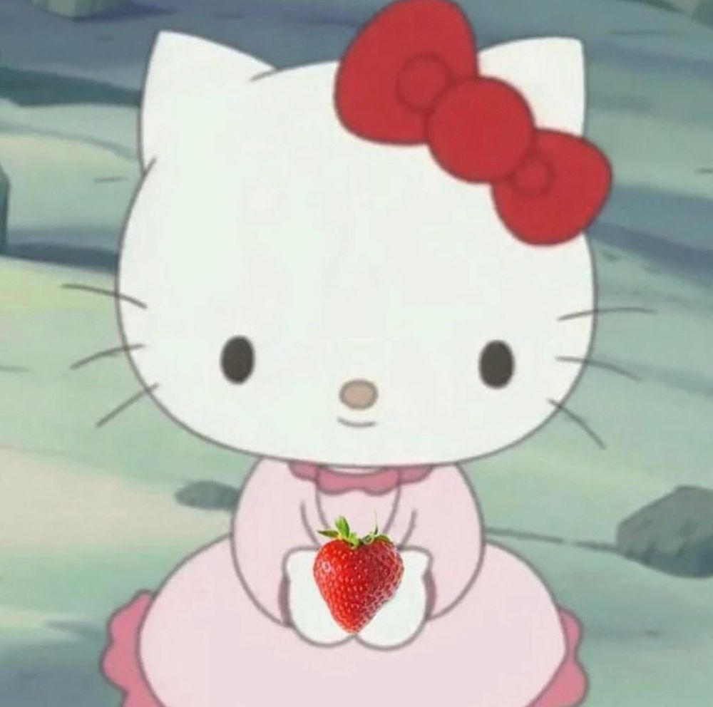 hello kitty holding a strawberry