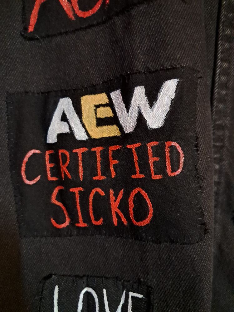Patch that says "aew certified sicko"