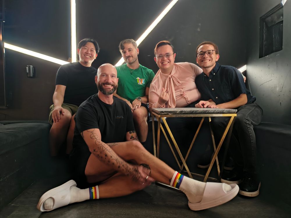 Five singers sitting in the VIP