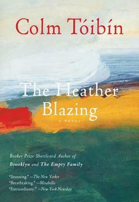 The cover of The Heather Blazing by Colm Tóibín. Loose muted colours like a semi-abstract painting of a coast.