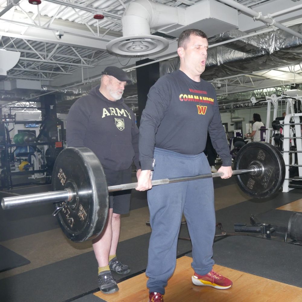 Gabriel Homes resident lifting weights.