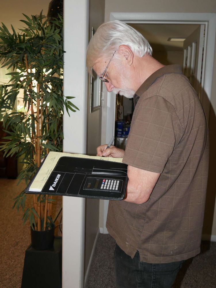 Board member Gary Le Francois writing.