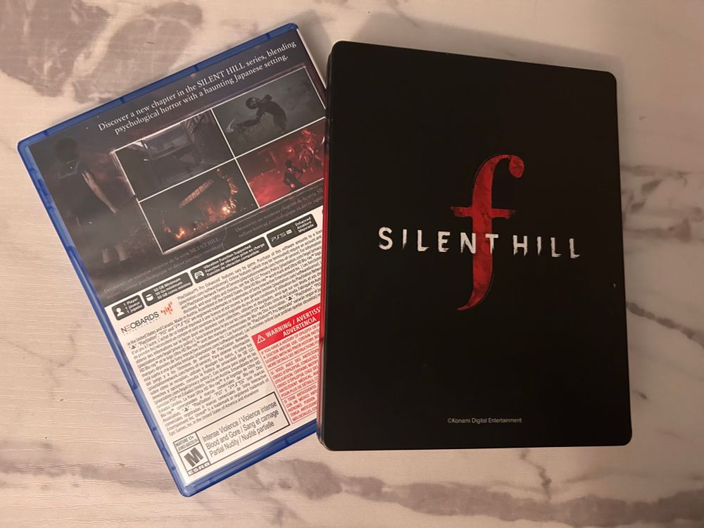 Silent Hill F base copy back and steelbook showing Silent Hill F text.