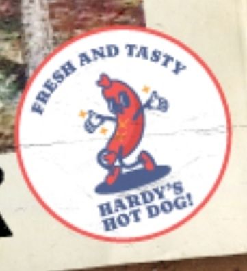 A cartoon mascot of a hot dog in a wide opened, welcoming stance with the text FRESH AND TASTY HARDY'S HOTDOG!