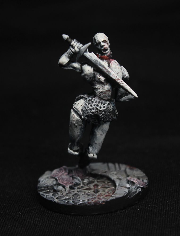 A figure of a slightly floating giant doll, creepy and armed with a sword.