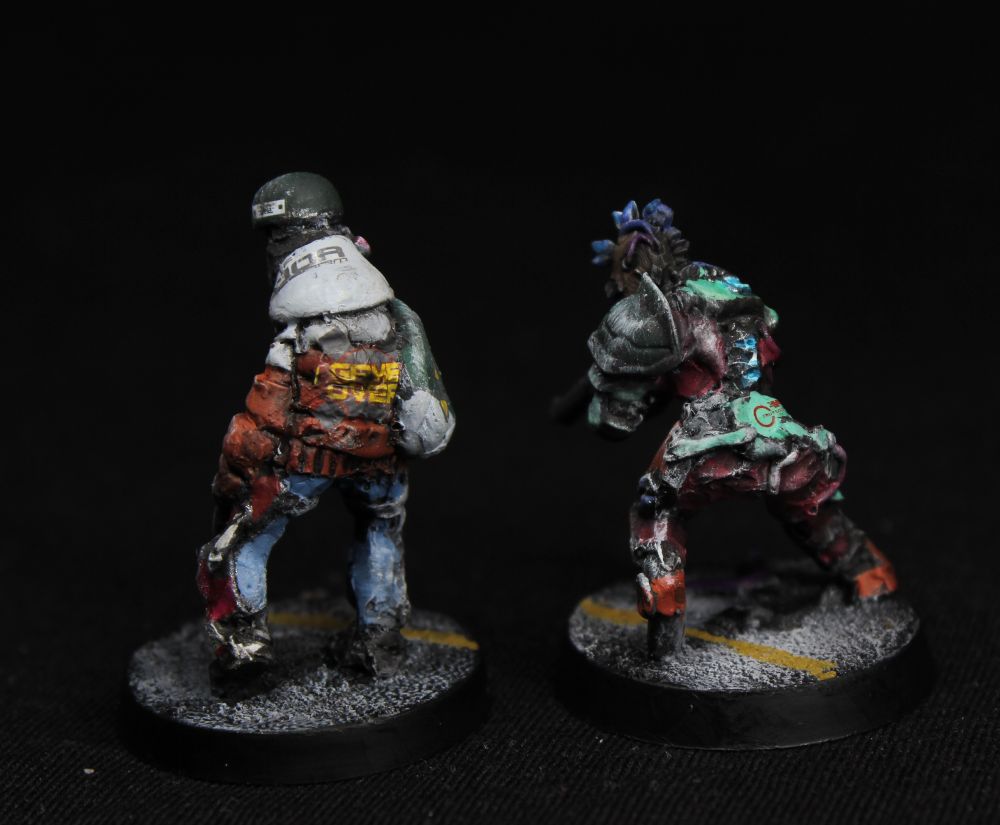 View from the back.
Exposed exoskeleton is medical pale green.
The puffy jackeet has GAME OVER written on its back.