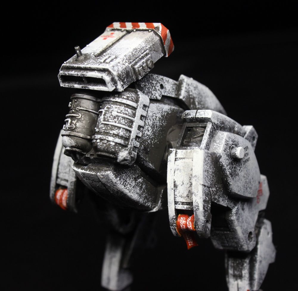 View from the back, top half.
There are rolls of orange caution tape on the back of its legs (caution label is white, and is a decal).