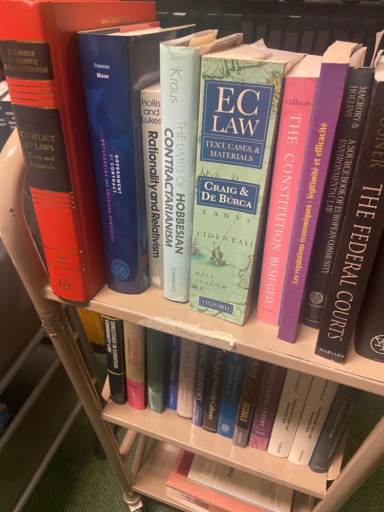 A cart of books with a volume called “EC Law” has inspired our skeeter to be exceptionally silly, naming names of formative comic book artists who used to publish at EC Comics.