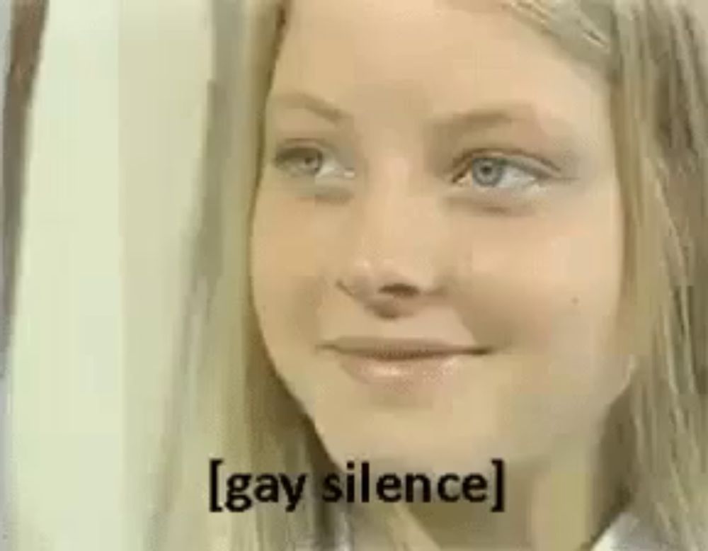 a young girl is making a funny face and saying `` gay silence '' .