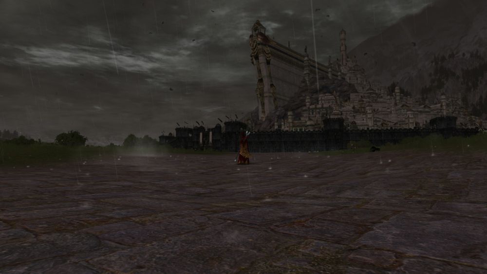 On a stormy day, a lone figure stands before Minas Tirith looking upon the city